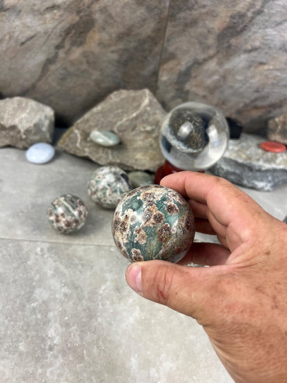 Polished Madagascan Flower Agate Sphere: Reflective Home Decor Stone